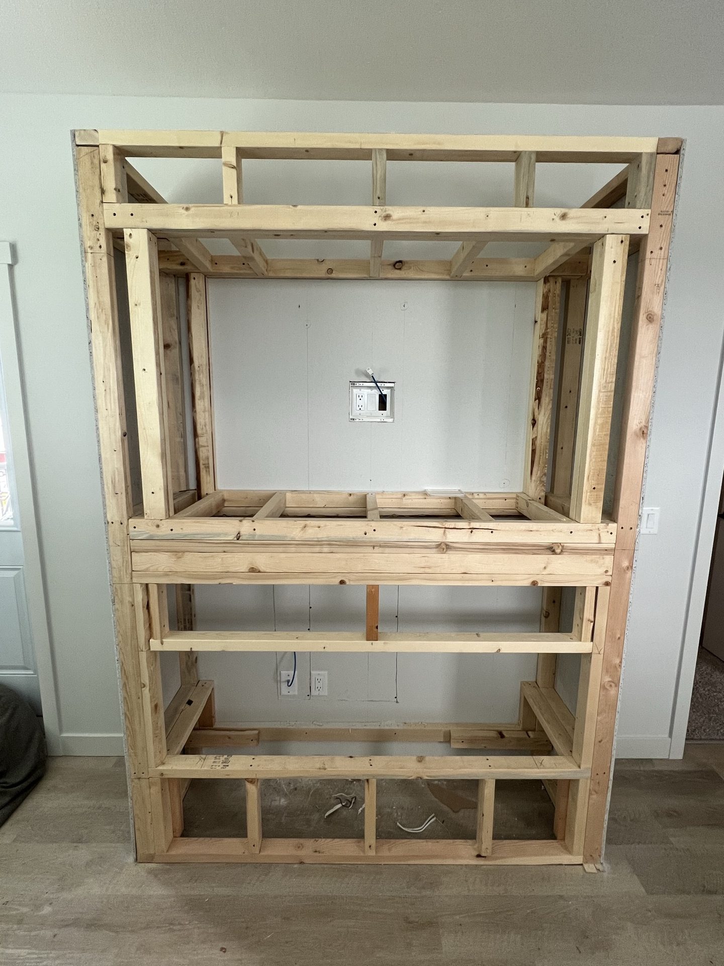 Rough framing for a custom fireplace feature wall