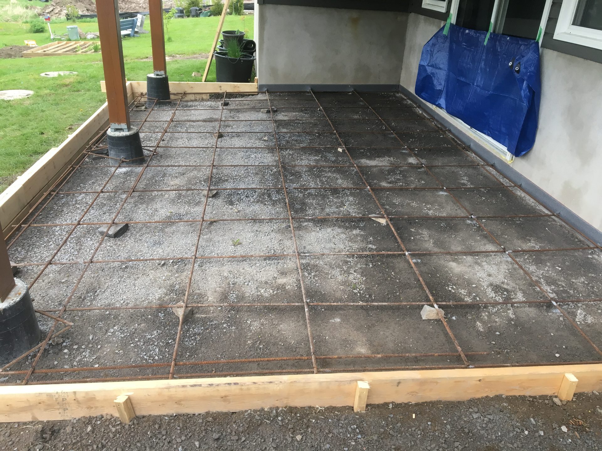 Concrete patio slab preparation with rebar grid